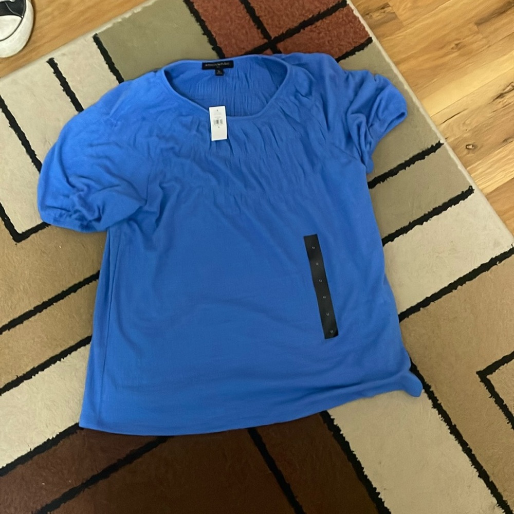Medium blue t-shirt (never worn)